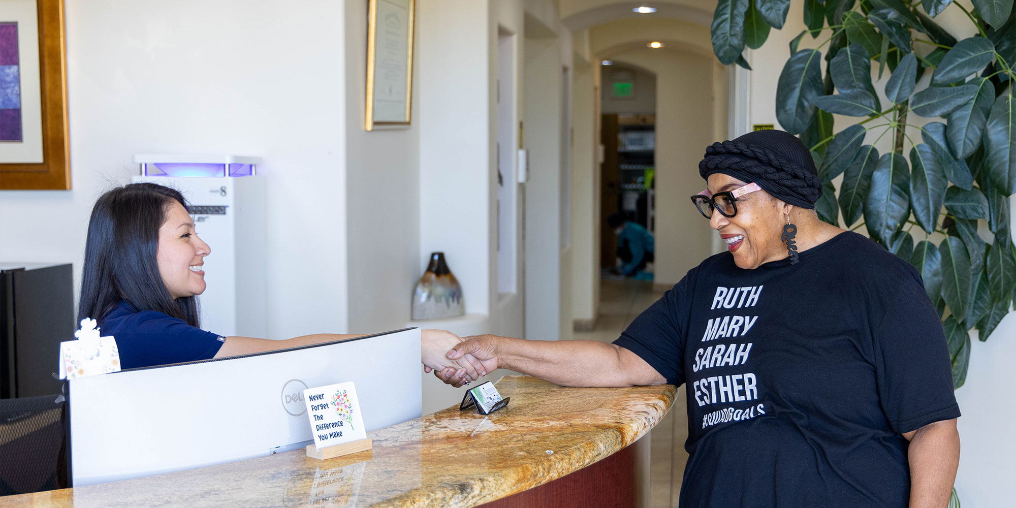 team member shaking patients hand