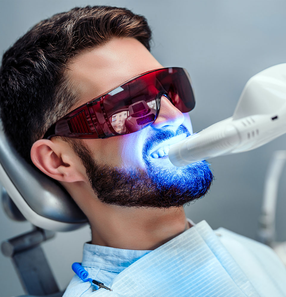 man getting teeth whitened