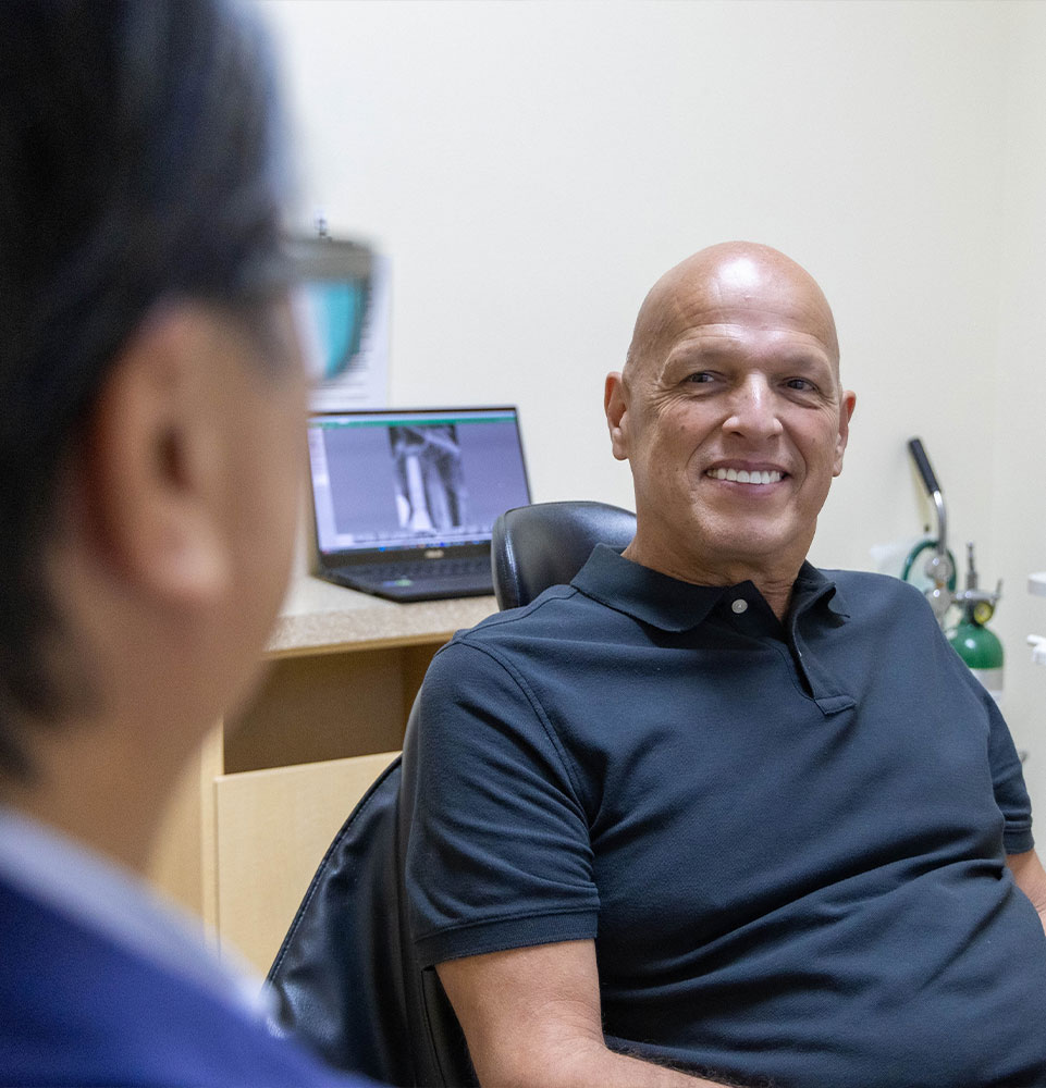 Dr. Truong talking to patient about their gums