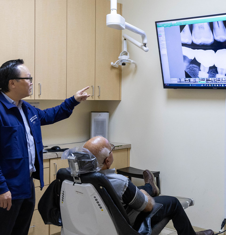 Dr. Truong going over oral surgery procedure with patient